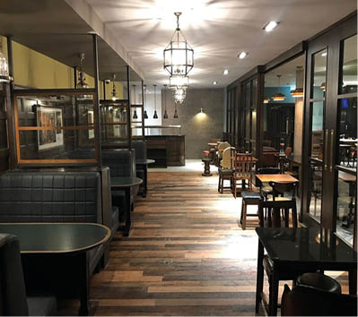 A picture containing indoor, ceiling, floor, table  Description automatically generated