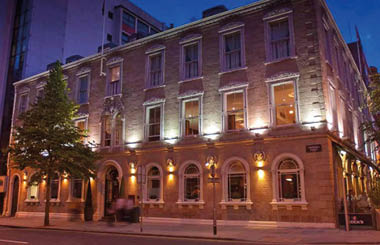 A picture containing building, outdoor, road, street  Description automatically generated