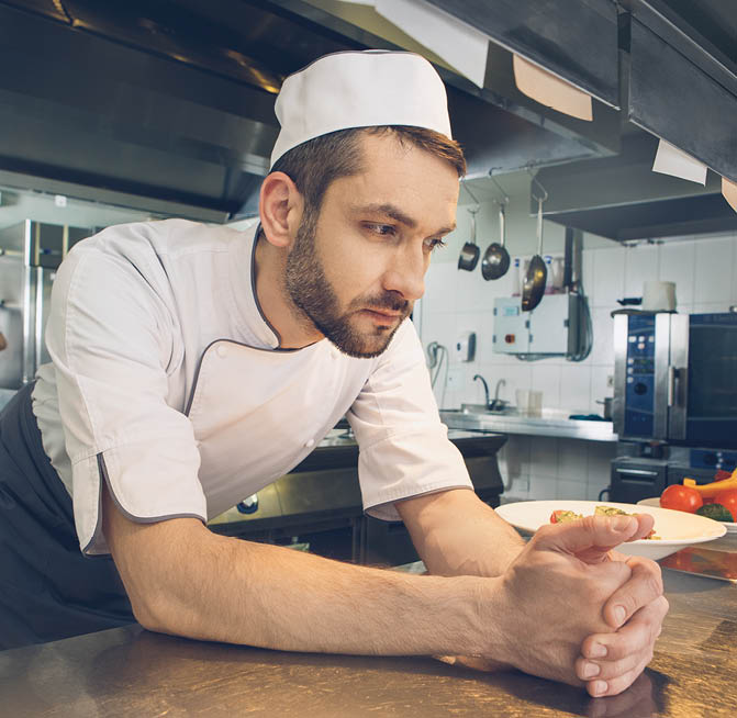 Man japanese restaurant chef cooking in the kitchen