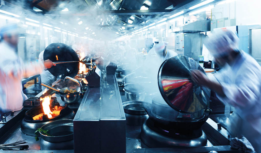 Motion chefs in a Chinese restaurant kitchen 