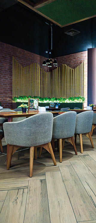 Samarinda, Indonesia - Februari 17, 2022 : Dining area from a cafe andcoffe shop with indirect lamp wooden backdrop