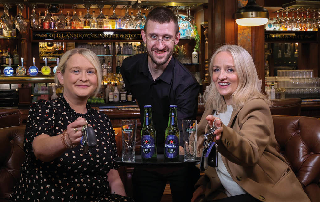 DRIVING HOME FOR CHRISTMAS: With the Christmas party season fast approaching, Craigavon-based drinks distributor United Wines has launched details of its festive Designated Driver campaign to help Northern Ireland revellers enjoy the party season and get home safe. Starting from November 18, the initiative will see partygoers who volunteer themselves as a designated driver rewarded with a free Heineken®0.0 or Birra Moretti Zero when they make themselves known to bar staff by showing their car keys at participating venues. Launching the safe driving campaign are Gemma Herdman (left) and Maura Bradshaw of United Wines, with Willy Erwin of The Lansdowne on Antrim Road, Belfast.  