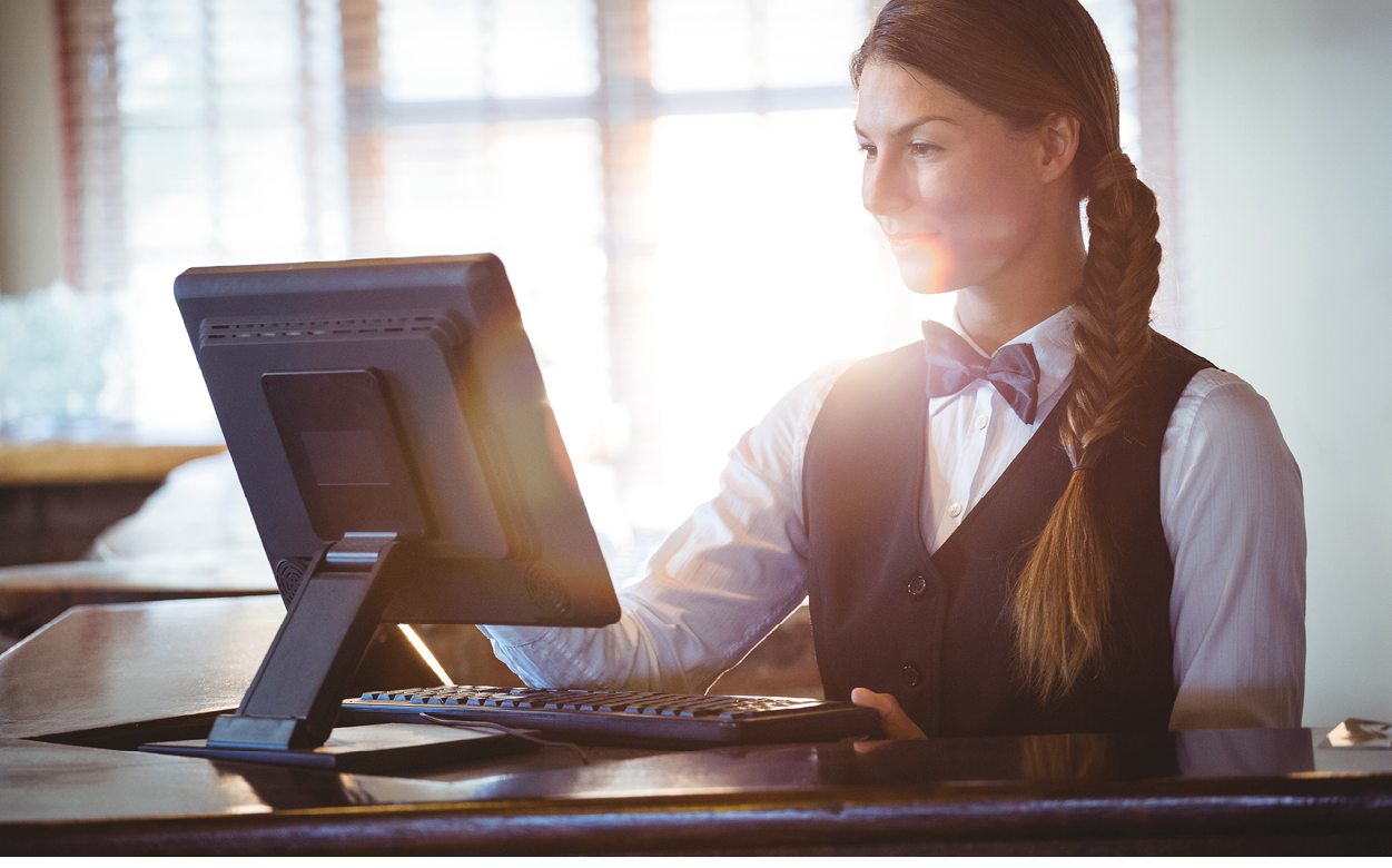 Waitress using a touchscreen in a restaurant