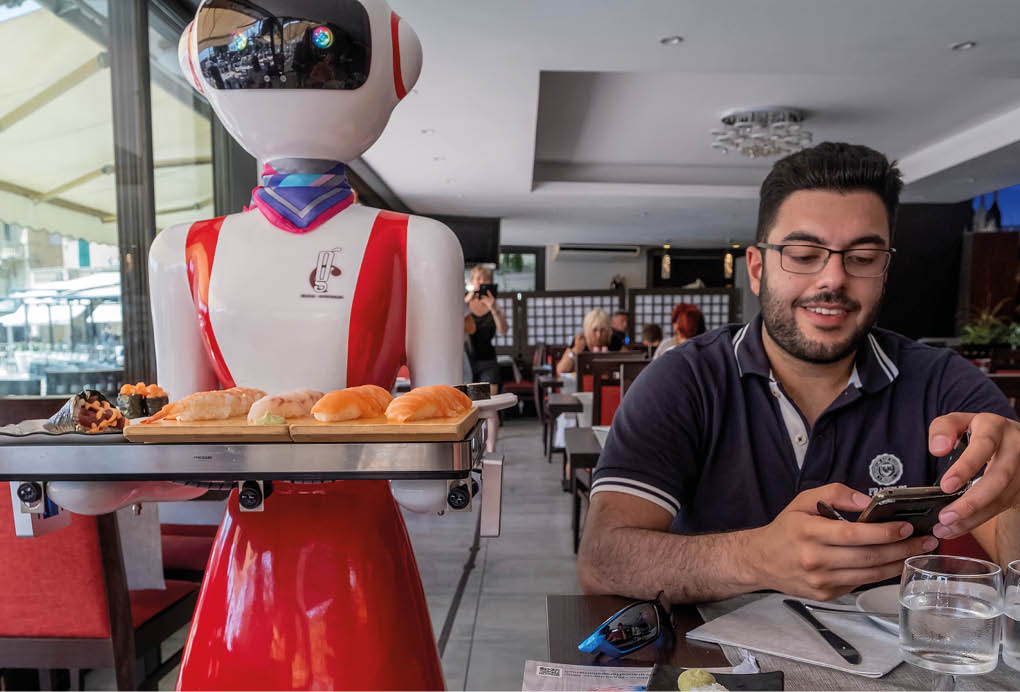 RAPALLO, ITALY - JULY 25: Waiter robot brings the dishes on July 25, 2019 in Rapallo, Italy  The  Gran CaffÃ  Rapallo  restaurant in Liguria is the first restaurant in Italy to use robot waiters