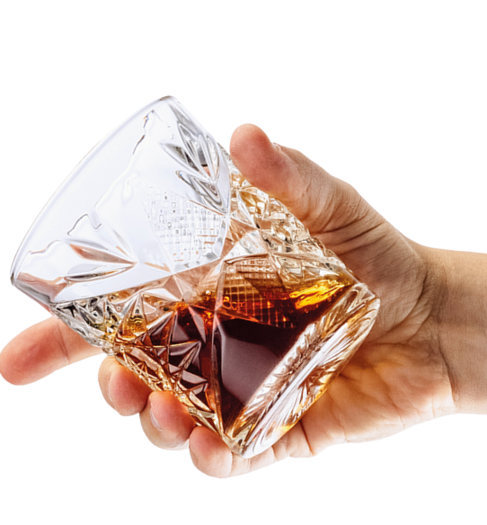 Strong drink degustation  Cropped image of male hand holding glass with whiskey or rum isolated over white background  Concept of alcohol, drink, party, degustation, holiday  Copy space for ad