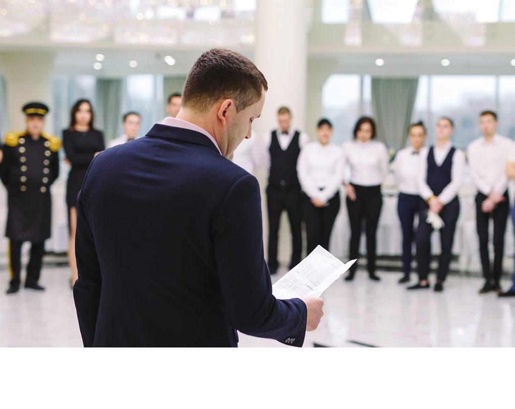 Briefing at the restaurant. The Manager is briefing the restaurant.. interacting to head chef in commercial kitchen.
