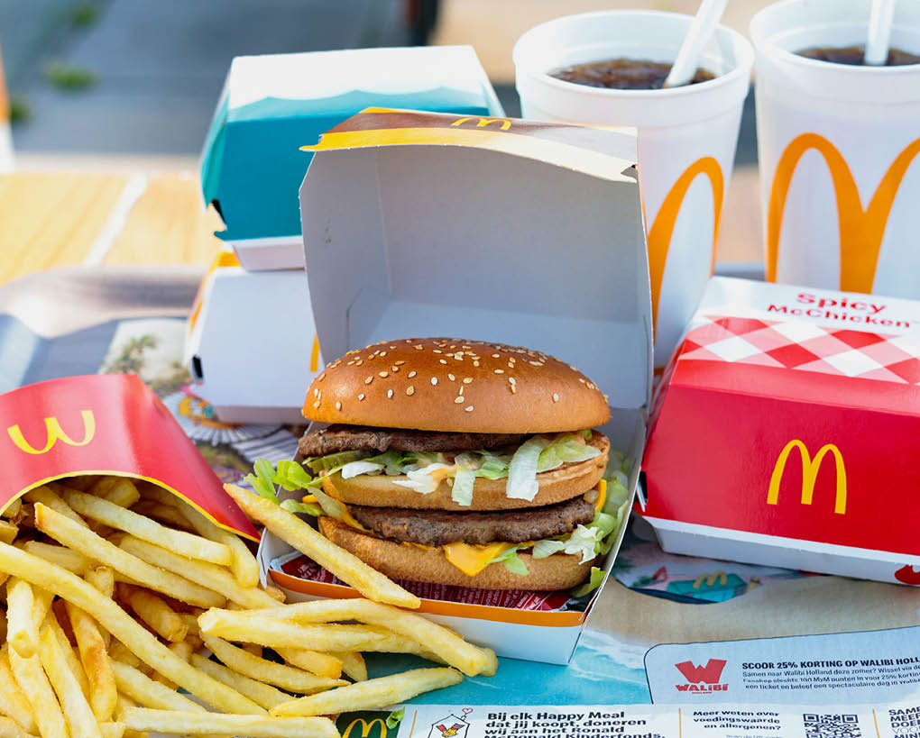 Amsterdam, Netherlands-June 5, 2024: fast Food set from McDonald's restaurant . Close up various burgers with French fries, cola drinks and sauces from McDonald's restaurant. 