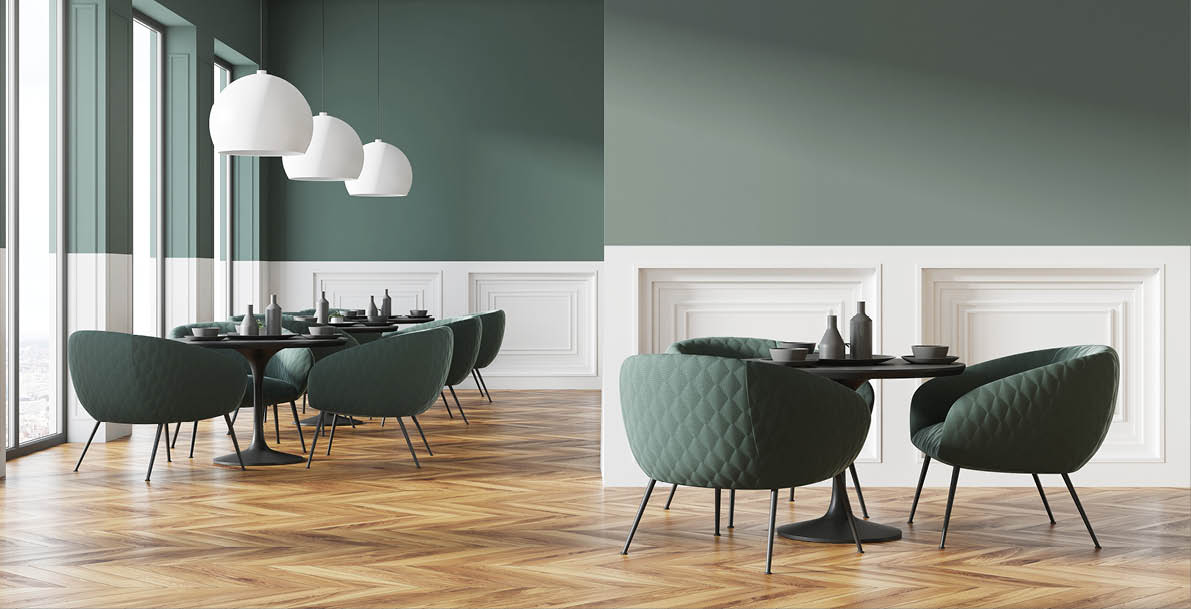 Green and white cafe interior with a wooden floor, round black tables and green chairs  A blank wall fragment  3d rendering mock up