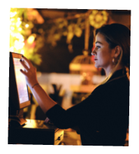 small business, people and service concept - A young waitress at counter in a small bar or restaurant