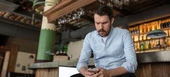 Restaurant, cafe, bar closed due to COVID-19 or Coronavirus outbreak lockdown, stressed owner of small business, depression. Businessman exhausted, upset. Business, economy, finance crisis.