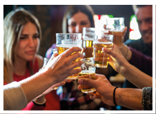 Group of happy friends having party in a bar - Young people drinking beer