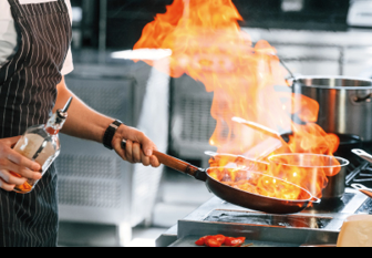 Focused on work. Chef is on the kitchen preparing food.