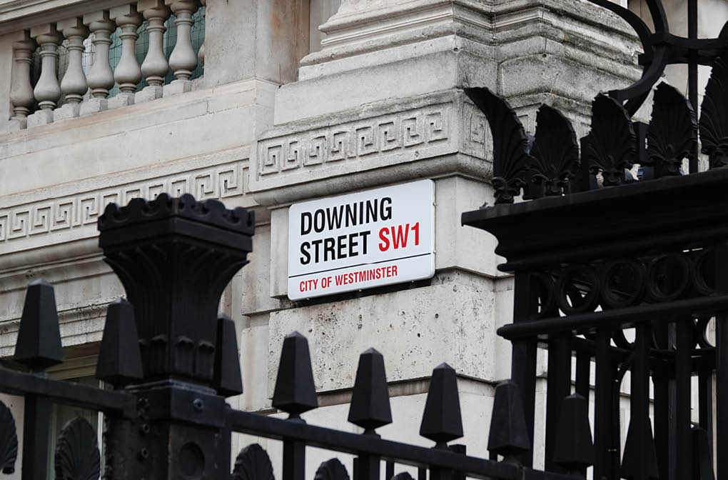 London, UK - March 15, 2023: Downing Street sign on the wall of a government building in Westminster, London SW1, England.