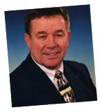 A person in a suit and tie Description automatically generated