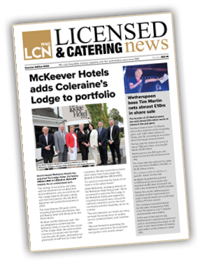 A person in a suit and tie Description automatically generated