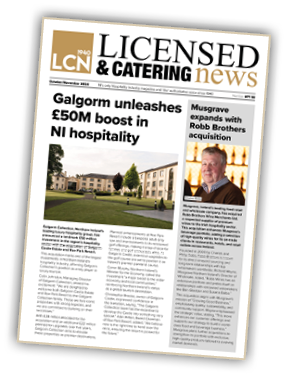 A person in a suit and tie Description automatically generated