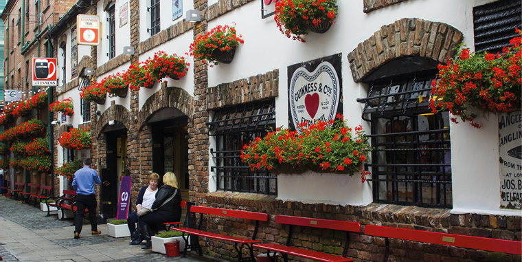 3 August 2017 Patrons outside the famous historic Duke of York pub in Commercial Lane in the Cathedral Quarter of Belfast, Northern Ireland.