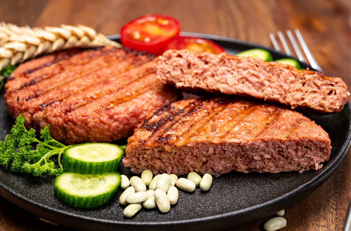 Source of fibre plant based vegan soya protein grilled burgers, meat free healthy food close up