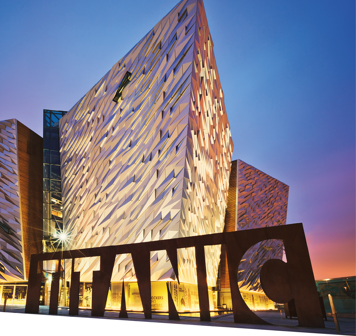 BELFAST, NORTHERN IRELAND - JUNE 28, 2017: Sunset over Titanic Belfast - museum, touristic attraction and monument to Belfast's maritime heritage on the site of the former Harland and Wolff shipyard.