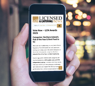 Mockup image of hand holding black mobile phone with blank white screen in cafe