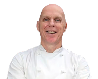 A man wearing a white shirt and apron. Description generated by AI