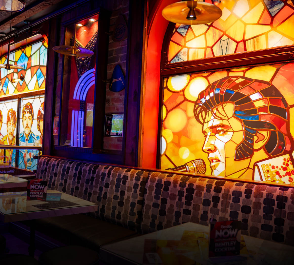 A restaurant with a mural of Elvis on the wall. Description generated by AI