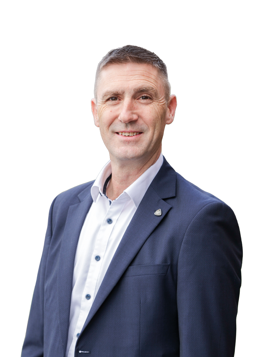 A man wearing a blue suit and white shirt. Description generated by AI