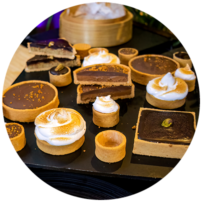 A tray of desserts with various flavors and toppings. Description generated by AI