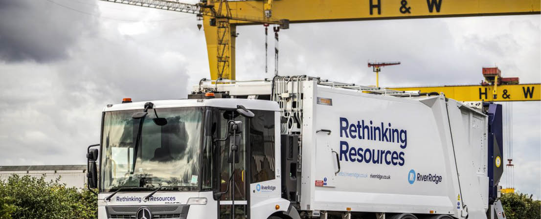 A large white truck with a Mercedes Benz logo is parked in front of a crane. AI generated content
