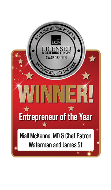 A red and gold award graphic announces the winner of the Licensed & Catering News Entrepreneur of the Year 2026 as Niall McKenna, MD & Chef Patron of Waterman and James St. Description generated by AI