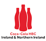 Three red stylized Coca-Cola bottles are arranged with one in the center and two behind it, above the text “Coca-Cola HBC Ireland & Northern Ireland." Description generated by AI