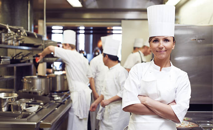 Restaurant, chef and portrait of woman with arms crossed for culinary service, job and pride in kitchen. Fine dining, person and face of cook in food industry for catering, career and hospitality