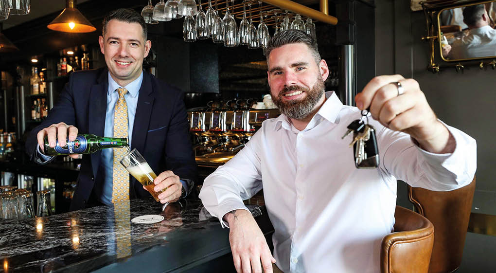 DRIVING HOME FOR CHRISTMAS: United Wines Brand Manager David Greenlees (right) and Gary McDonald, Hotel Manager at the Ebrington Hotel in Derry~Londonderry, launch the drinks company’s festive Designated Driver campaign to help Northern Ireland revellers get home safe during the Christmas party season. Starting from Monday November 17, the initiative will see partygoers who volunteer themselves as a designated driver rewarded with a free Heineken® 0.0 or Birra Moretti Zero when they make themselves known to bar staff by showing their car keys at participating venues. A full list of venues, which this year includes the 4-star Ebrington Hotel, can be found at www.unitedwines.co.uk/blog. 