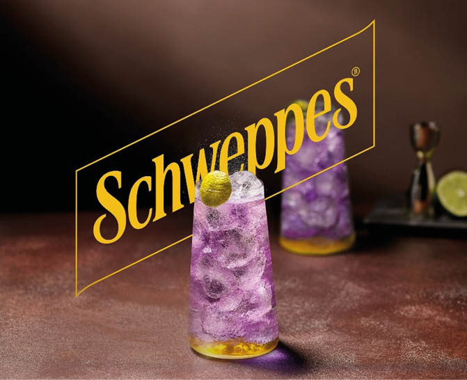 A bottle of Schepes is on a table. Description generated by AI
