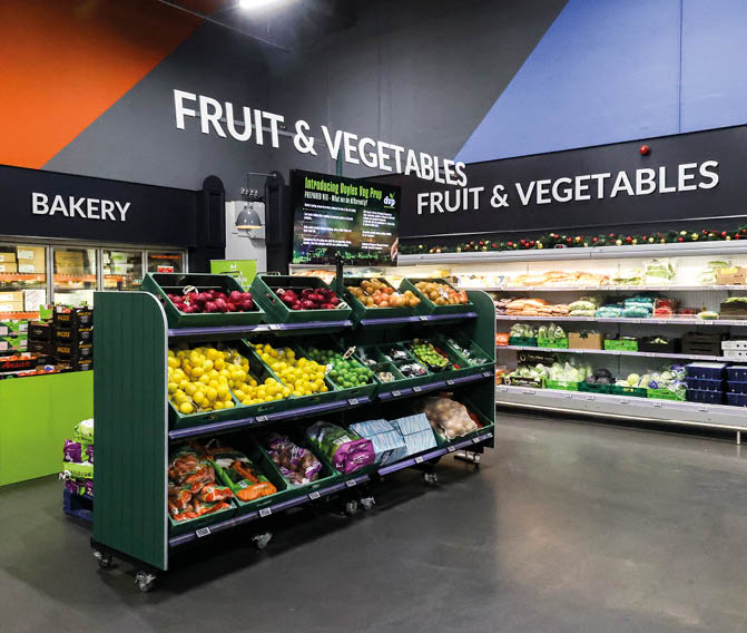A fruit and vegetable stand in a grocery store. Description generated by AI