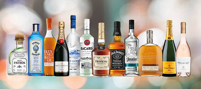 A row of bottles of alcohol. Description generated by AI