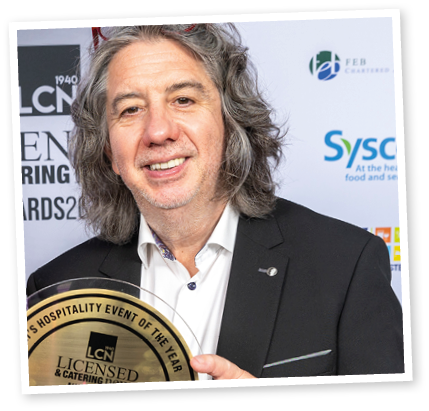 A man and a woman are holding a gold award. Description generated by AI