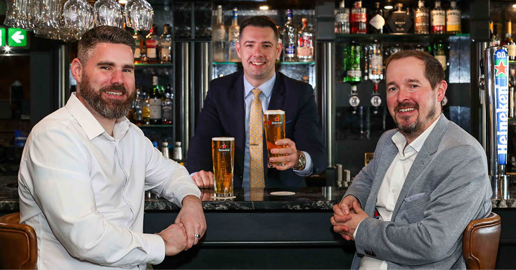 ZERO PINTS: The Ebrington Hotel in Derry~Londonderry is the first hospitality venue in Northern Ireland to install a new 20-litre Heineken 0.0 draught system, strengthening its commitment to offering premium alcohol free choices for guests. Visitors to the 4-star hotel can now enjoy a perfect pint of NI’s most popular non-alcoholic beer direct from the keg – with more Heineken 0.0 draught taps to be rolled out across Northern Ireland this year. Ebrington Hotel Manager Gary McDonald (centre) is pictured serving up a couple of cold refreshing pints of Heineken 0.0 to David Greenlees (left) and Andrew Hollywood of Craigavon-based drinks distributor United Wines. 