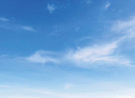 sky is blue and clear with no clouds. The sun is shining brightly, making the sky look even brighter