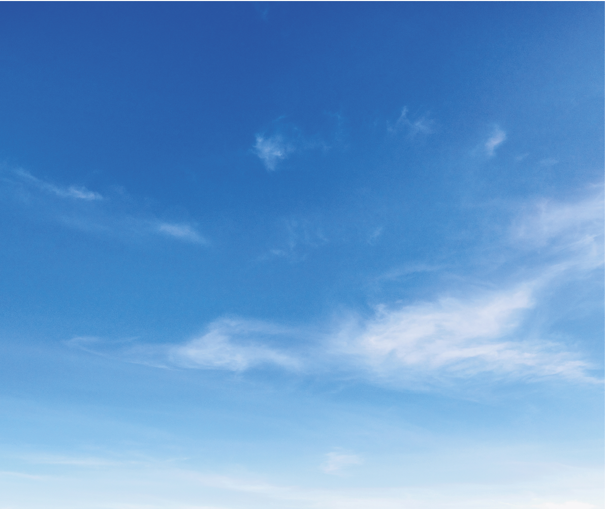 sky is blue and clear with no clouds. The sun is shining brightly, making the sky look even brighter