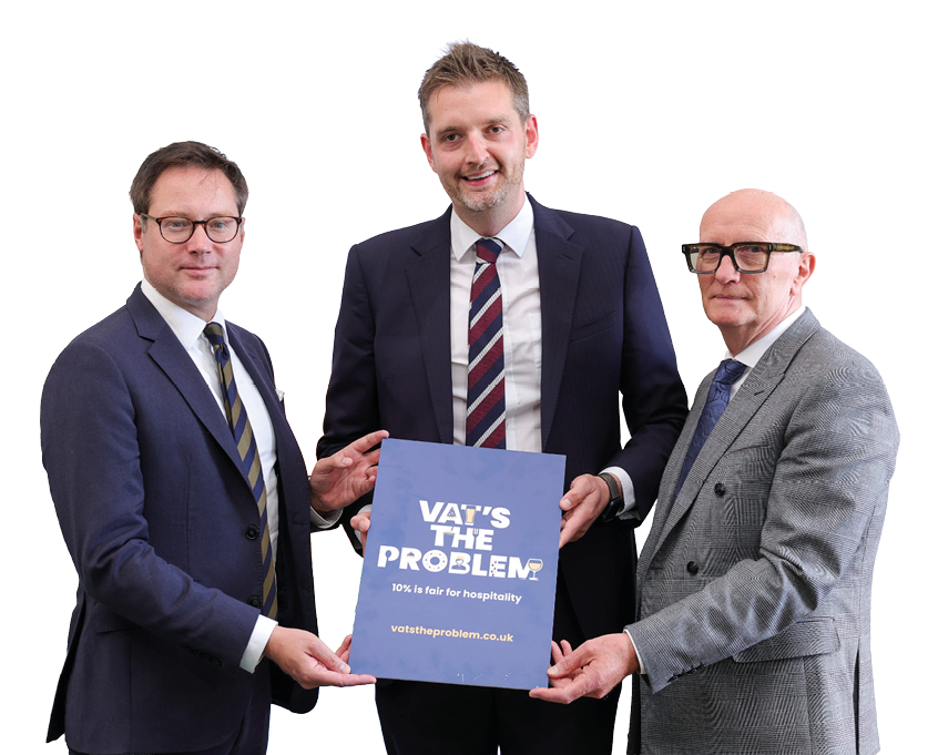 Three adults in business suits stand together holding a sign that reads “VAT'S THE PROBLEM 10% is fair for hospitality vatstheproblem.co.uk" against a white background. Description generated by AI