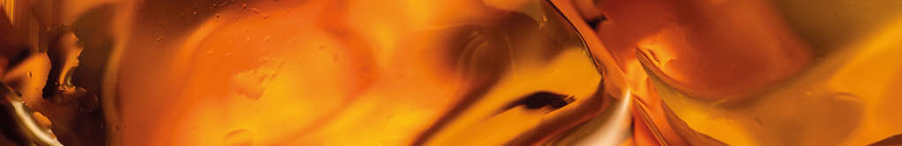 Close-up of amber-colored liquid with smooth, glossy texture and light reflections. Description generated by AI