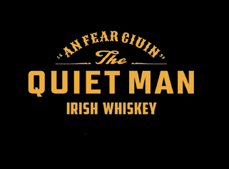 The image features stylized text reading “An Fear Giuin, The Quiet Man Irish Whiskey" in a bold, vintage font on a black background. Description generated by AI