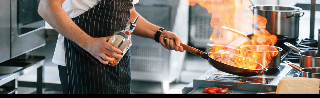 Focused on work. Chef is on the kitchen preparing food.