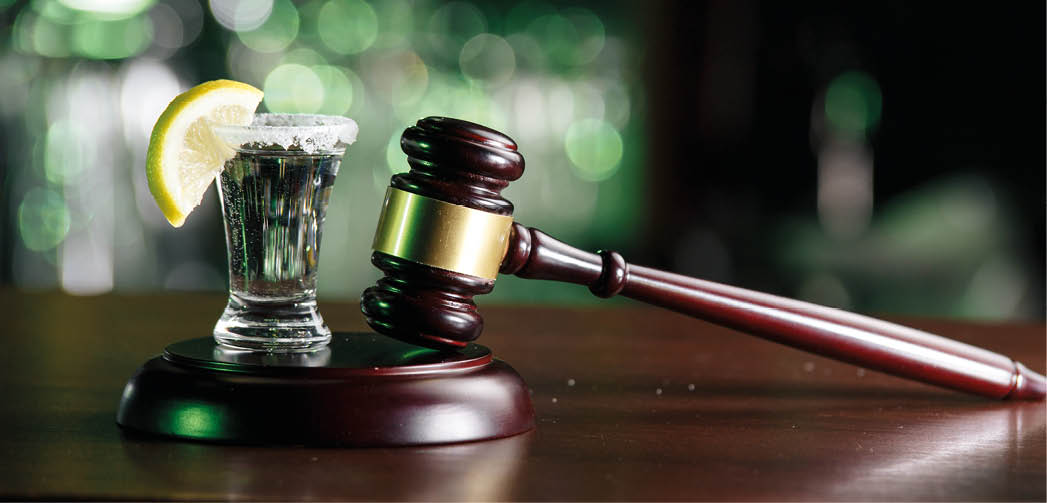 the concept for drink driving.judge hammer, lemon glass and tequila. Do not drink alcohol and do