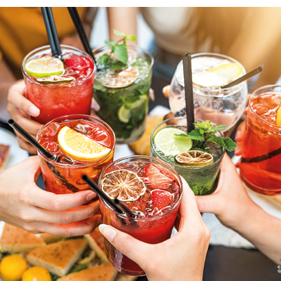 Happy people toasting cocktail glasses sitting at bar table - Cheerful friends enjoying happy hour at pub restaurant balcony - Food and beverage life style concept