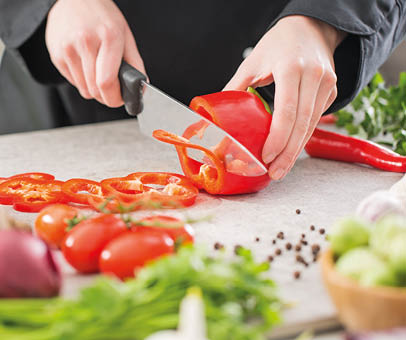 chef cooking food kitchen restaurant cutting prepare cook hands healthy hotel man male knife preparation fresh preparing young natural culinary domestic desktop dietary red concept - stock image 