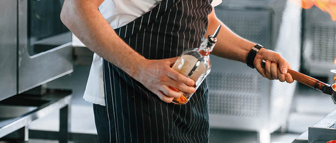 Focused on work. Chef is on the kitchen preparing food.